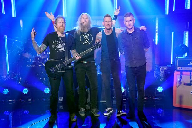 Brent Hinds و Troy Sanders و Brann Dailor و Bill Kelliher of Mastodon على المسرح في عام 2021.
